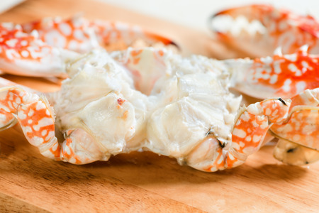  Fresh boiled and dressed crabs on wooden boardの写真素材