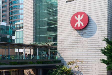 HONG KONG CHINA  18 JAN 2015: Public transportation passengers entering a central transit station in downtown Hong Kong China.のeditorial素材
