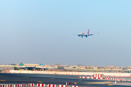 DUBAI, UAE - 17 JULY 2014: Passenger liner from Spicejet, on final approach for landing at Dubai International Airport.のeditorial素材