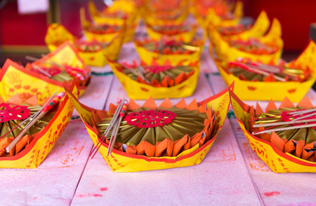 BANGKOK, THAILAND - 8 FEB 2016: Carefully Prepared Offerings on an Altar at a Buddhist Templeのeditorial素材