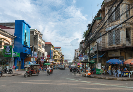 PHNOM PENH, CAMBODIA - 16 DEC 2013: Typical city street corner in Phnom Penh on a partly cloudy day.のeditorial素材