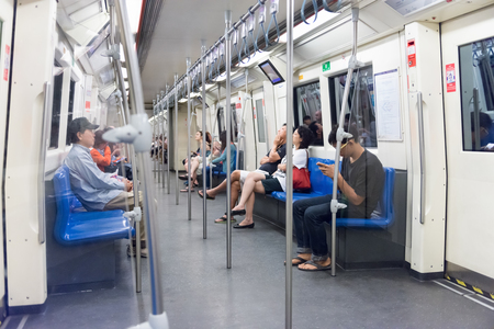 BANGKOK, THAILAND - 7 FEB 2016: Commuting passengers aboard Bangkok's MRT rail system.のeditorial素材
