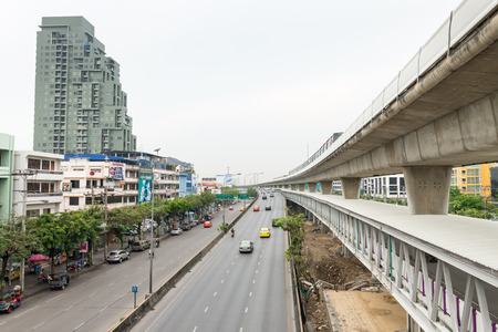 BANGKOK, THAILAND - 12 APR 2013: Elevated Skytrain rail system with Skypass pedestrian walkway beneath, in Bangkok.のeditorial素材