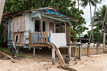 Concept of low-cost budget staying in tropical paradise house on a beach for economical tourists.の写真素材