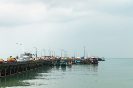 SAMUI, THAILAND - 06 MAR 2013: Nathon passenger pier at Koh Samui, on the cloudy day with many sea transport and boats.のeditorial素材