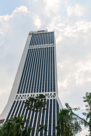 KUALA LUMPUR, MALAYSIA - 31 OCT 2014: Maybank tower skyscaper. The tower is the headquarters of Maybank and houses the Maybank Numismatic Museum.のeditorial素材