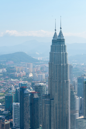 MALAYSIA, KUALA LUMPUR- FEB 2015: KL modern city skyline with Patronas Twin towers landmark.のeditorial素材