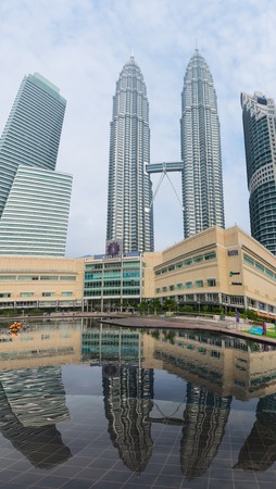 KUALA LUMPUR, MALAYSIA - OCT 31, 2014: Petronas twin Towers building and Suria KLCC shopping mall.