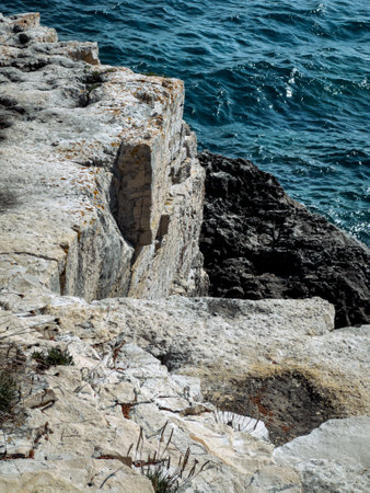 A close up of a rocky shore near the ocean, seaの写真素材