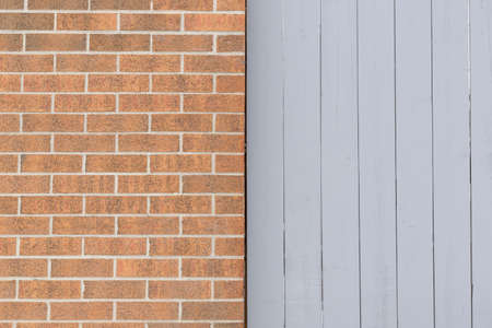 Brick wall and wooden fence texture backgroundの写真素材