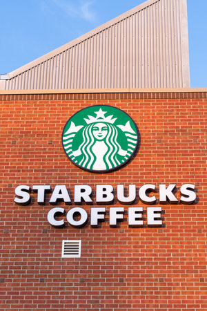 Ottawa, Canada - March 19, 2021: Starbucks coffee sign on the building. Popular cafeのeditorial素材