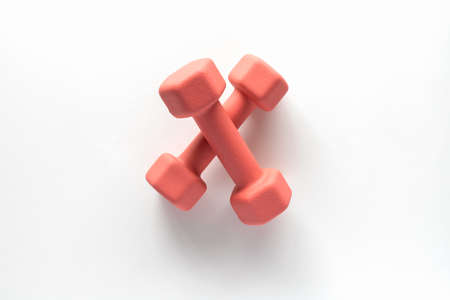 Dumbbells on white background. Fitness, sport and workout concept flat lay. Weights layout