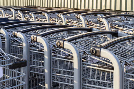 Shopping carts in a row outside a supermarket