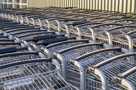Shopping carts in a row outside a supermarket