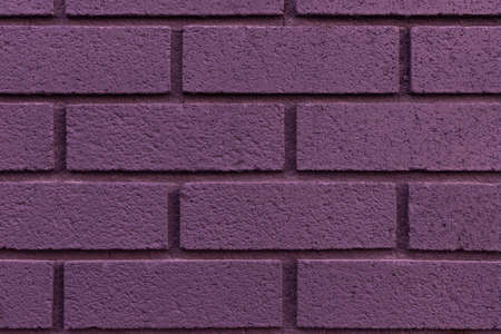 Close up of painted purple brick wall texture background.