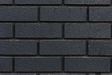 Close up of black brick wall texture background.の写真素材