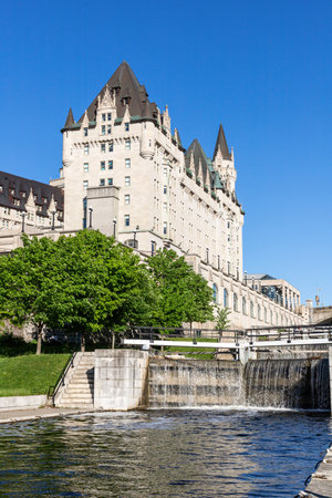 Ottawa, Canada - May 14, 2021: Rideau Canal locks and luxury Fairmont Chateau Laurier hotel in Ottawa, Canada on a sunny day.のeditorial素材