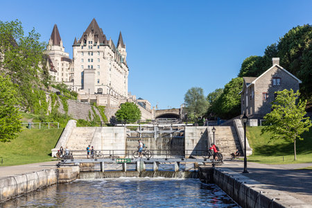 Ottawa, Canada May 23, 2021: Rideau Canal locks and luxury Fairmont Chateau Laurier hotel in Ottawa, Canada on a sunny day.のeditorial素材