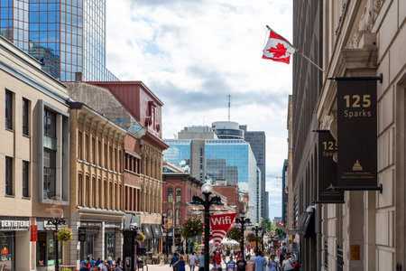 Ottawa, Canada - July 1, 2021: Cityscape street view with walking people in downtown of Ottawa. Sparks street during Canada day holiday.のeditorial素材