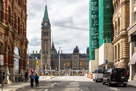 Ottawa, Canada - July 1, 2021: Cityscape street view with historical buildings, Parliament and walking people in downtown of Ottawa on Canada day holidayのeditorial素材