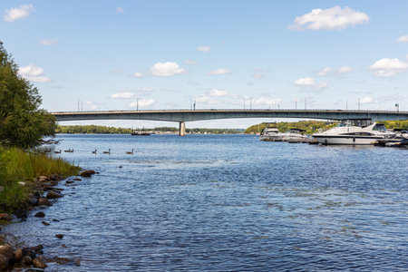 Ottawa, Canada - August 2, 2021: Macdonald-Cartier Bridge from Gatineau city of Quebec to Ottawa, Ontario in Canada. Ottawa river on a sunny summer dayのeditorial素材