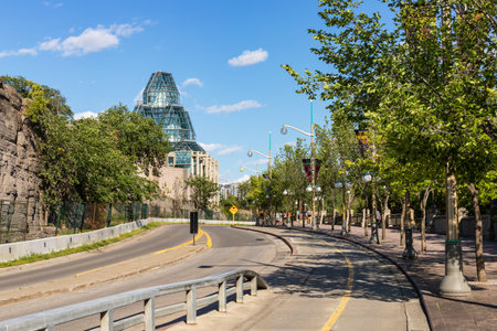 Ottawa, Canada - August 2, 2021: Road from Alexandra Bridge in downtown of Ottawa city on sunny summer day and National Gallery of Canada.のeditorial素材