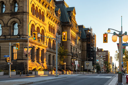 Ottawa, Canada - September 19, 2021: Wellington street view with traffic lights at intersection with Elgin street and old historical buildings in downtown of Ottawa in sunny summer evening.のeditorial素材