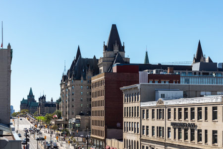 Ottawa, Canada - September 19, 2021: Aerial view of cityscape of busy Ottawa downtown, Rideau street and Parliament building with people walking on sidewalk, traffic lights and cars on road.のeditorial素材