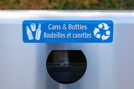 Ottawa, Canada- October 7, 2021: Garbage bin for cans and bottles to recycle. Trash container in public place.のeditorial素材
