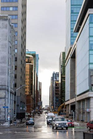 Ottawa, Canada - December 16, 2021: Cityscape view with skyscrapers and cars on road in downtown of Ottawa, Elgin Street and Slater St. Business and office buildingsのeditorial素材