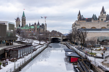 Ottawa, Canada - December 16, 2021: Rideau canal and Parliament in downtown Ottawa, Canada in winter season.のeditorial素材