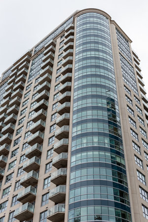 Ottawa, Canada - December 16, 2021: Modern tall residential apartment building in downtown area....