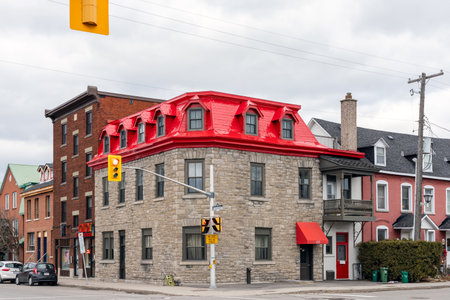Ottawa, Canada - December 17, 2021: City view with traffic lights at crossroads and house with red roof in downtown. Cityscape.のeditorial素材