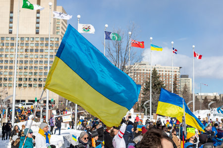 Ottawa, Canada - February 27, 2022: Rally with Ukrainian flags in support of Ukraine against war. Protest and march against Russian invasion of Ukraine.のeditorial素材