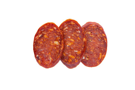 Salami sausage slices isolated on white background.の写真素材