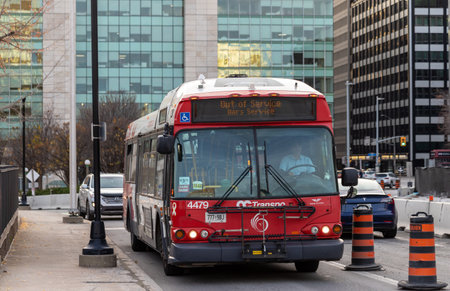 Ottawa, Canada - November 5, 2022: Public bus on road in downtown with out of service sign.のeditorial素材