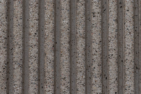 Grey textured striped stone wall background, full frame