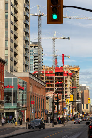 Ottawa, Canada - November 5, 2022: Rideau street in downtown Ottawa, Canada. Cityscape with construction sites, cranes, traffic, and walking people.のeditorial素材