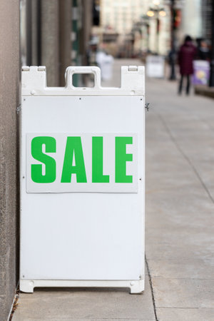 Sale sign in the street near a store in downtown Ottawa, Canadaの写真素材