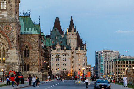 Ottawa, Canada - November 5, 2022: City view of downtown in the evening with walking people near Parliament building.のeditorial素材
