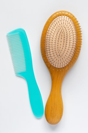 Hair brush and comb on white backgroundの写真素材