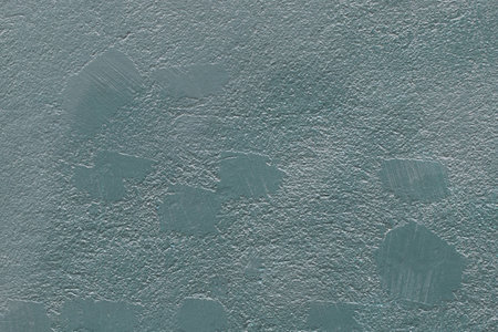 Abstract teal painted with stains stone uneven texture wall backgroundの写真素材