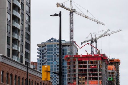 Ottawa, Canada - January 23, 2023: Construction site with cranes in downtown district.のeditorial素材