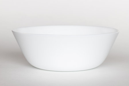 Empty white bowl on a white backgroundの写真素材