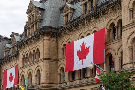 Canada, Ottawa - July 1, 2022: Canada Day. Canadian flags on building. Office of the Prime Minister and Privy Council.のeditorial素材