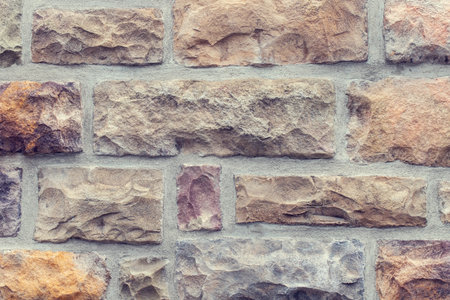 Stone wall textured background, building exterior close up