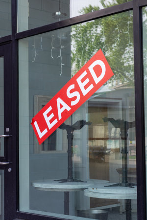 Leased sign on window of a cafe. Rental commercial property.の写真素材