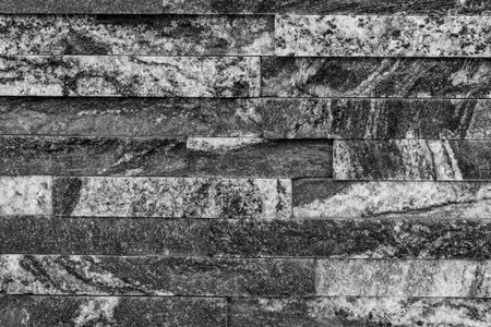 Decorative black and white stone wall texture backgroundの写真素材