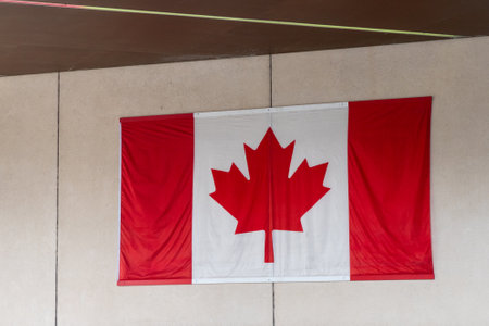 Canadian flag hanging on a wall.の写真素材