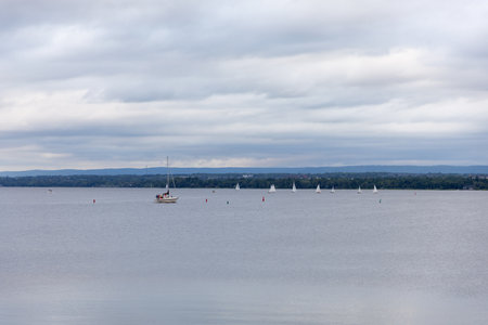 Riverside with sailing boats. Yachts on the water.Ottawa river in Canada. Landscape with waterfront and cloudy sky.の写真素材